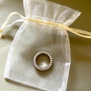 Shiny “diamond” but not diamond 💍 ring.  Cute but too big for me.